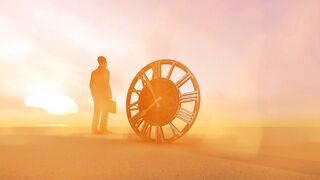 Man in the desert next to a large old clock