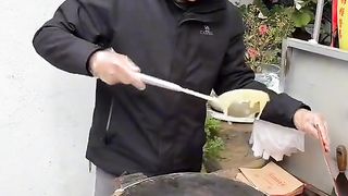 The man Chineses selling his food...