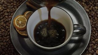 Pouring coffee in a cup