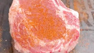 Smoked tomahawk steak with bacon and herb compound butter