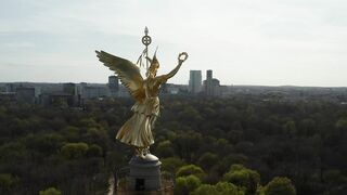Statue of a golden angel on a tower in Berlin