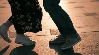Engaged couple dancing happily