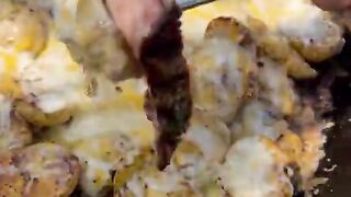 Grilled steak and cheesy potatoes