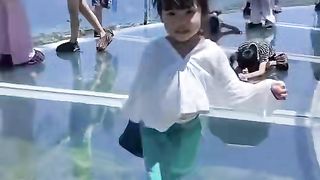 Beautiful little girl walk the highway