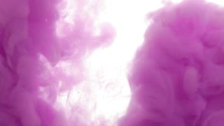 Purple color mix in water on a white background