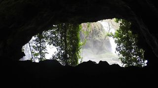 View of a waterfall from a cave