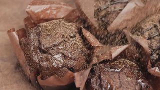 Sprinkle striped chocolate over chocolate cupcakes