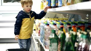 Little boy helping with the shopping.