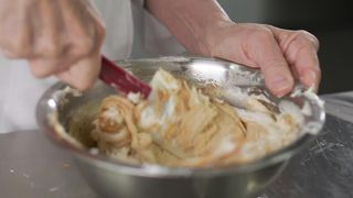 Pastry woman making a mix in a bowl