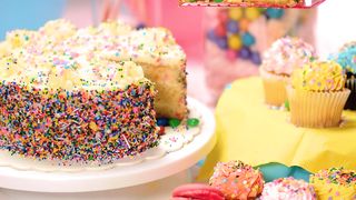 Taking a slice of birthday cake