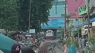 Two women were sitting relaxed even though the train was about to pass