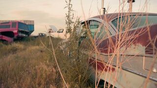 close-up-shot-of-an-old-destroyed-car-in-the-car-scrapyard