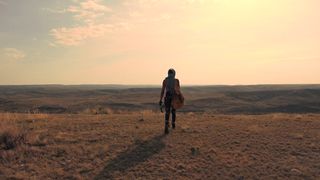 a-woman-comes-to-the-edge-of-the-hill