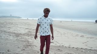 a-guy-cleaning-the-beach