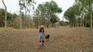 A Heartwarming Reunion: A Little Girl Runs Through the Forest to Greet Her Beloved Dog