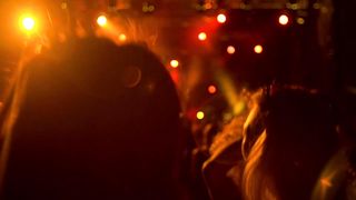 Boundless Energy: Young Women Leap for Joy at Concert
