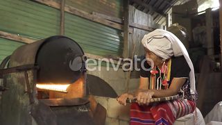A Karen Tribe Woman Roasting Coffee Beans Using Traditional Local Coffee