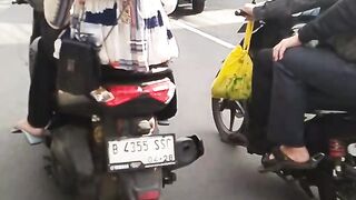 beautiful woman riding a motorbike
