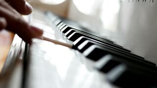 Fingers playing the piano