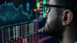Man analyzing the stock market in real time.