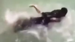 He is trying to kill him inside the water