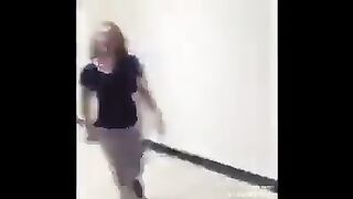 A policeman catches two girls fighting