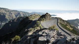Aerial shot of a curvy mountain road.