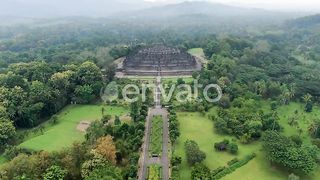 Aerial Odyssey: Drone Soars Over Lumbini Park Toward Majestic Borobudur Temple, Magelang, Indonesia