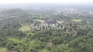 Borobudur Temple: A Majestic Aerial Perspective Over Java's Iconic Heritage Amidst Enchanting Forests