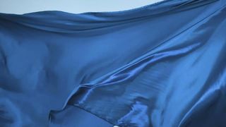 Bright blue fabric texture moving with the wind