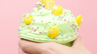 Woman kneading green plasticine in the shape of ice cream