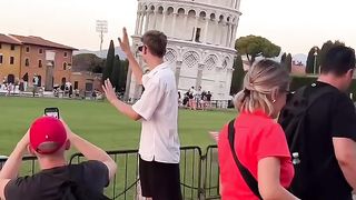 Everyone normal taking pictures at pisa tower