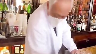 The bartender makes Irish coffee
