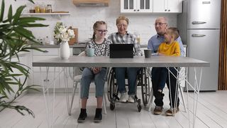 Generations Connected: Heartwarming Moments as Grandparents Watch a Video Together