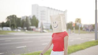 Invisible Journeys: An Anonymous Woman Wanders Through the Streets, Lost in Thought