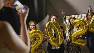 Cheers to 2024: Friends Capture Memories with Joyful New Year's Eve Photo