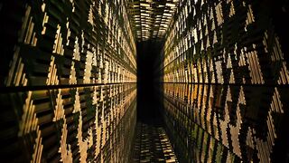 3D tour of a narrow corridor with golden walls