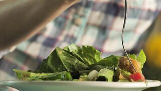 Person eating salad