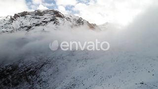 Mystical Tranquility: Exploring the Foggy Snowy Mountains