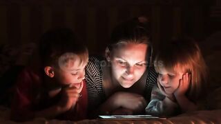 three family members watch phone