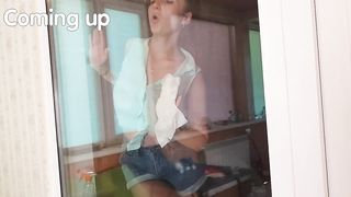 Beautiful Girl Cleaning the Window