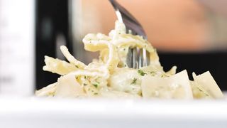 Eating fettuccine