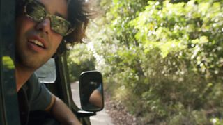 Man looking out a car window