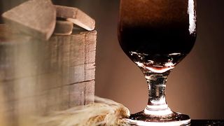 Dark beer with a lot of foam in a beautiful image composition
