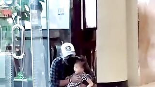 A funny scene: A father closes his daughter's eyes so that she does not see the toys