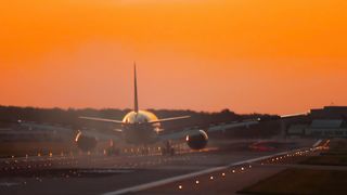 Airplane moving trough the airport track in the morning