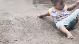 Child enjoying rain moment