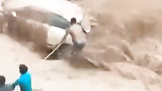 Rescue from a car caught in a stormy stream
