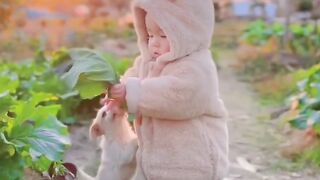 Cute baby play with dog