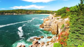 Aerial view of Acadia National Park coastline in foliage season, Maine